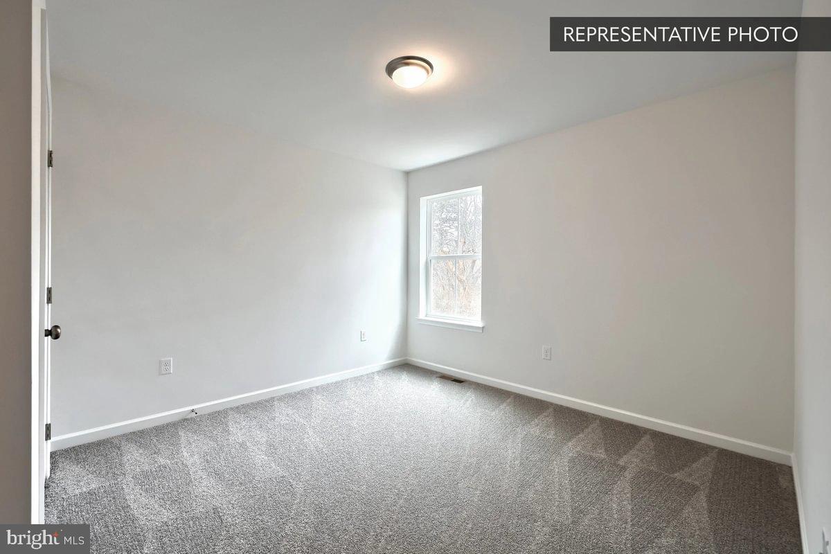 Pin Oak Plan At Hills Spring Grove, PA 17362 - Photo 21 of 38 an empty room with windows