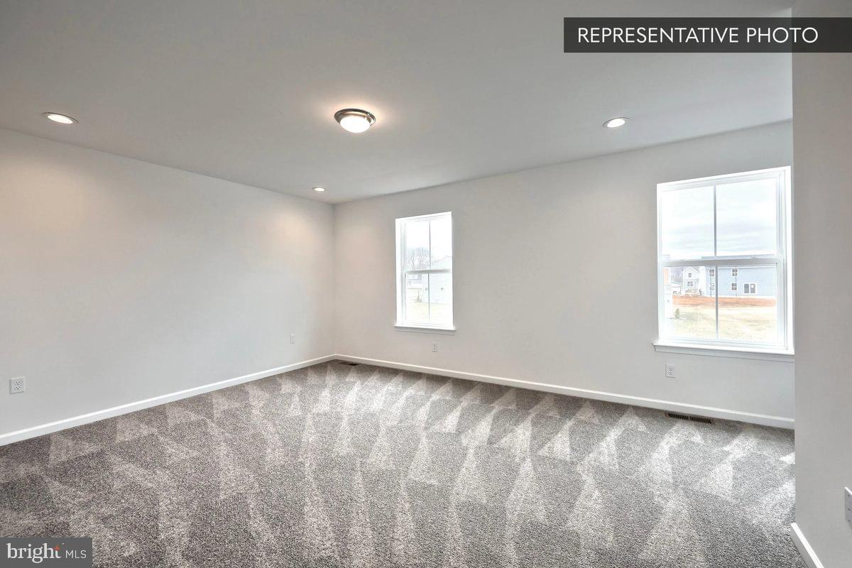 Pin Oak Plan At Hills Spring Grove, PA 17362 - Photo 24 of 38 a view of an empty room with a window