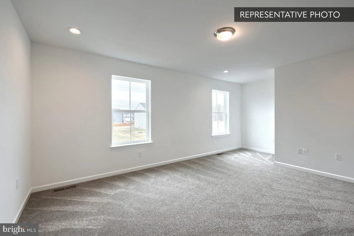 Pin Oak Plan At Hills Spring Grove, PA 17362 - Photo 26 of 38 a view of an empty room with a window