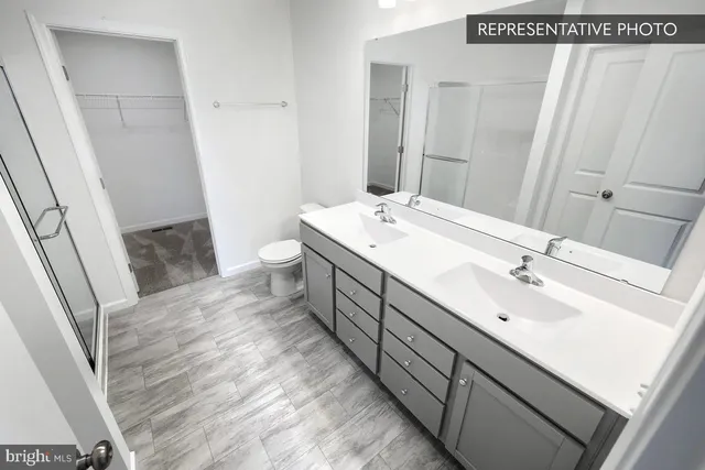 a bathroom with a sink toilet and vanity