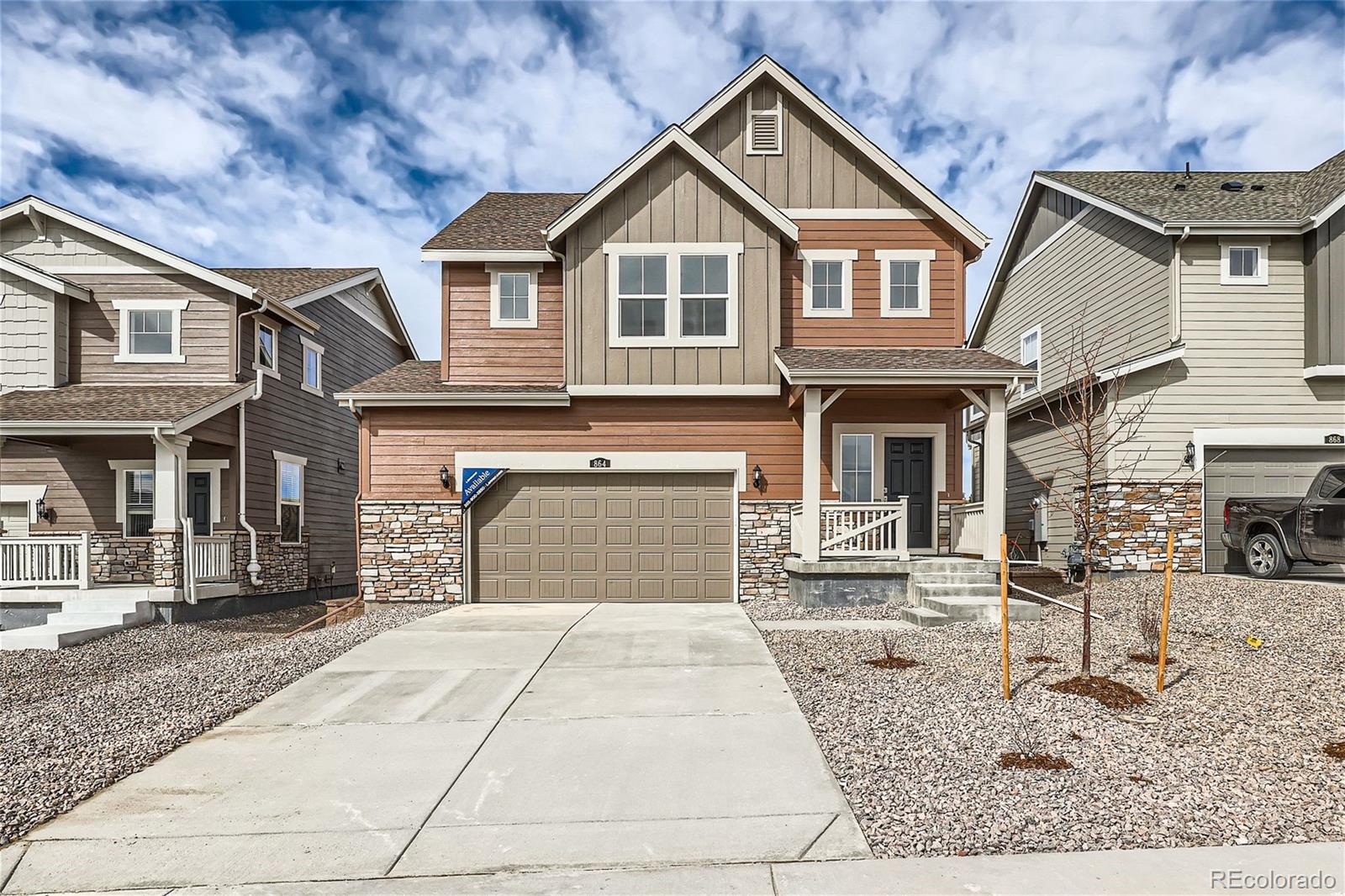 864 Yankee Boy Loop Elizabeth, CO 80107 - Photo 1 of 36 a front view of a house with a yard and seating space