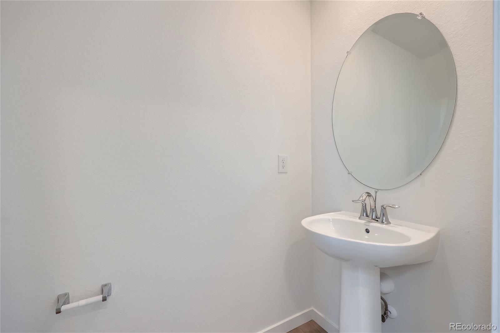 864 Yankee Boy Loop Elizabeth, CO 80107 - Photo 12 of 36 a bathroom with a sink and a mirror