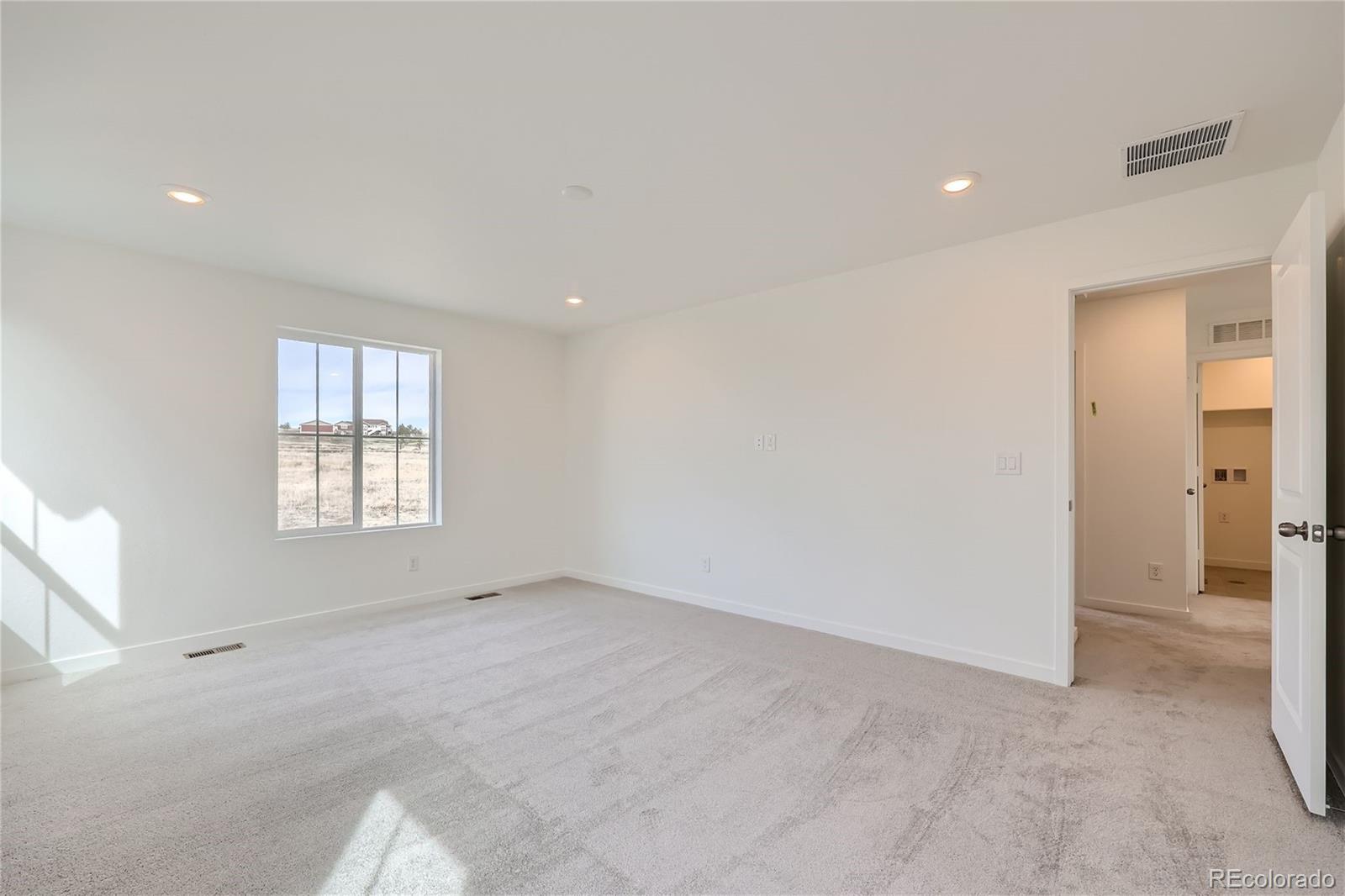 864 Yankee Boy Loop Elizabeth, CO 80107 - Photo 14 of 36 a view of an empty room with a window