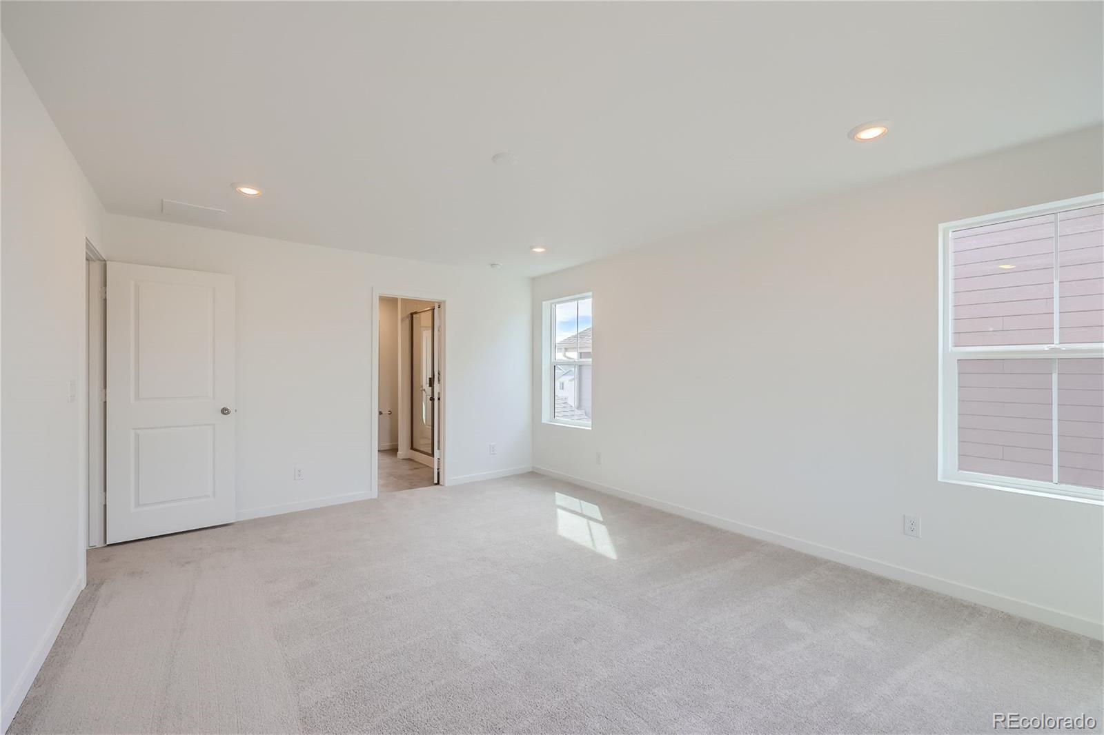 864 Yankee Boy Loop Elizabeth, CO 80107 - Photo 15 of 36 an empty room with windows and closet