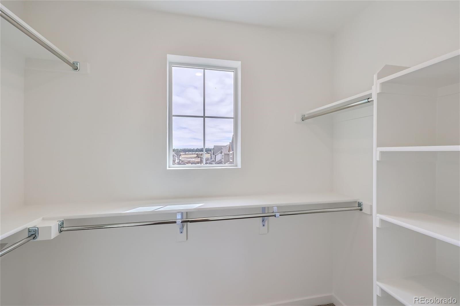 864 Yankee Boy Loop Elizabeth, CO 80107 - Photo 18 of 36 a view of a room with racks on the wall
