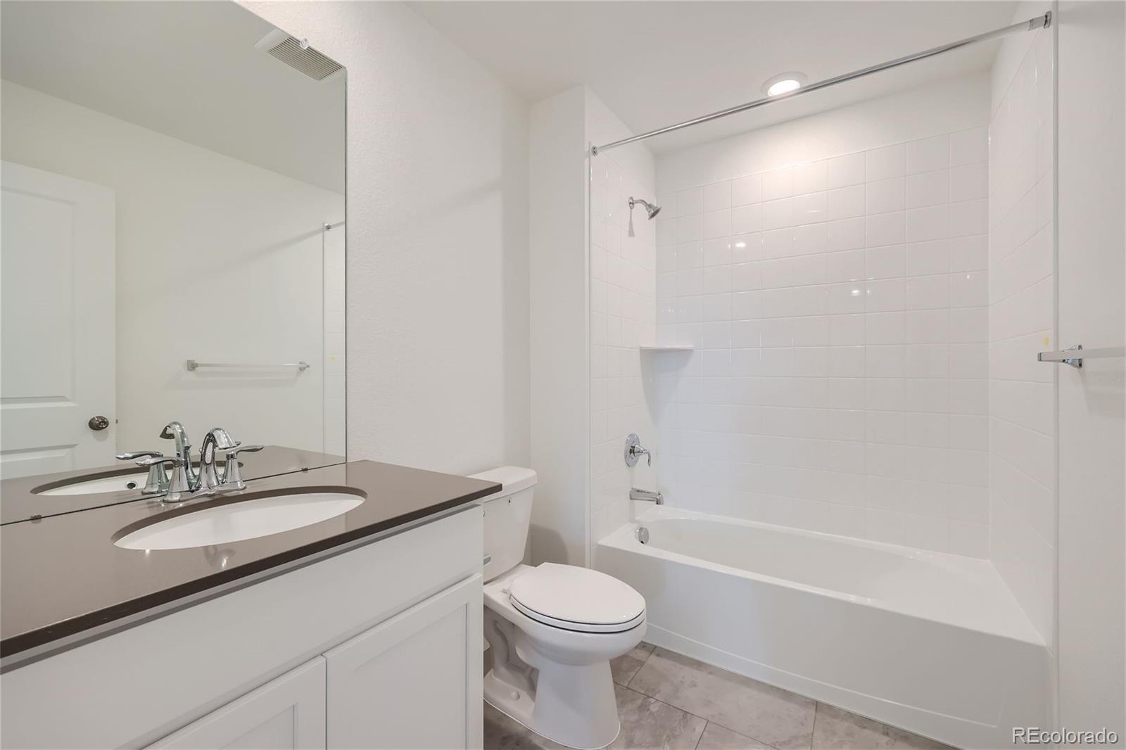864 Yankee Boy Loop Elizabeth, CO 80107 - Photo 22 of 36 a bathroom with a sink a toilet and shower