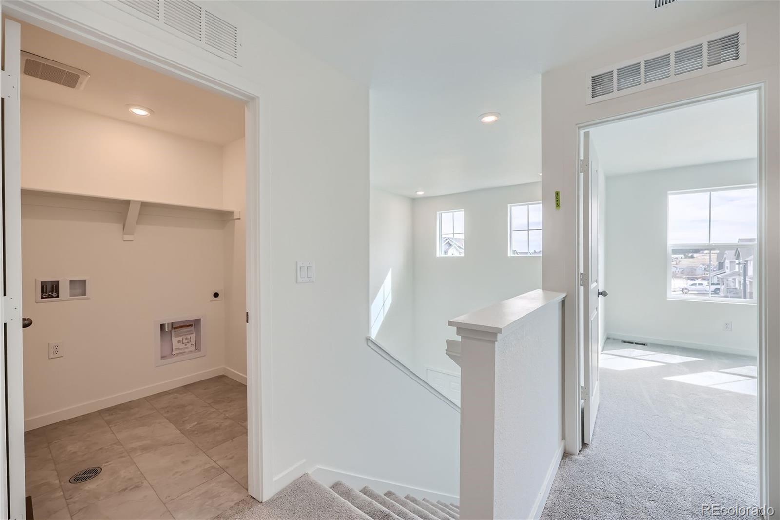 864 Yankee Boy Loop Elizabeth, CO 80107 - Photo 23 of 36 a view of a hallway with windows and entryway