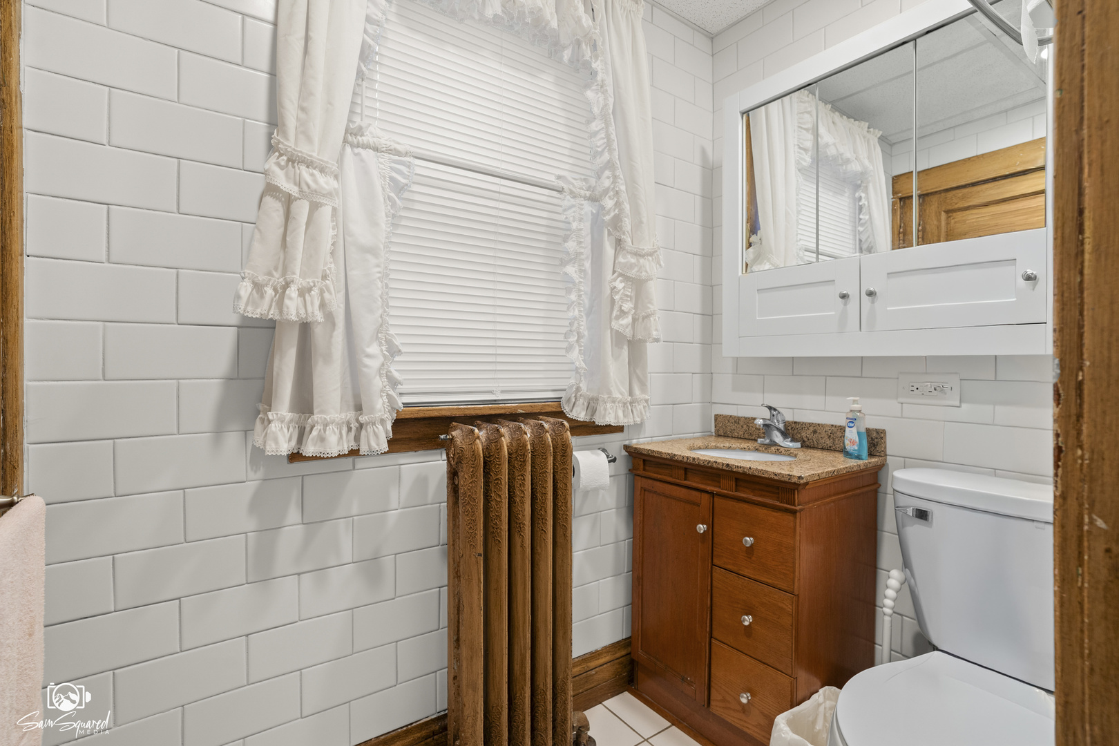 276 West 2nd Street Manteno, IL 60950 - Photo 12 of 20 a bathroom with a granite countertop toilet sink and mirror