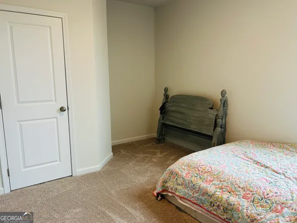 a bedroom with a bed and a cabinets