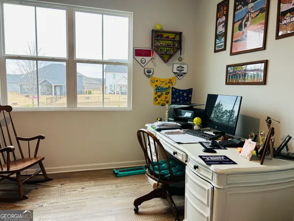 a work room with furniture and window