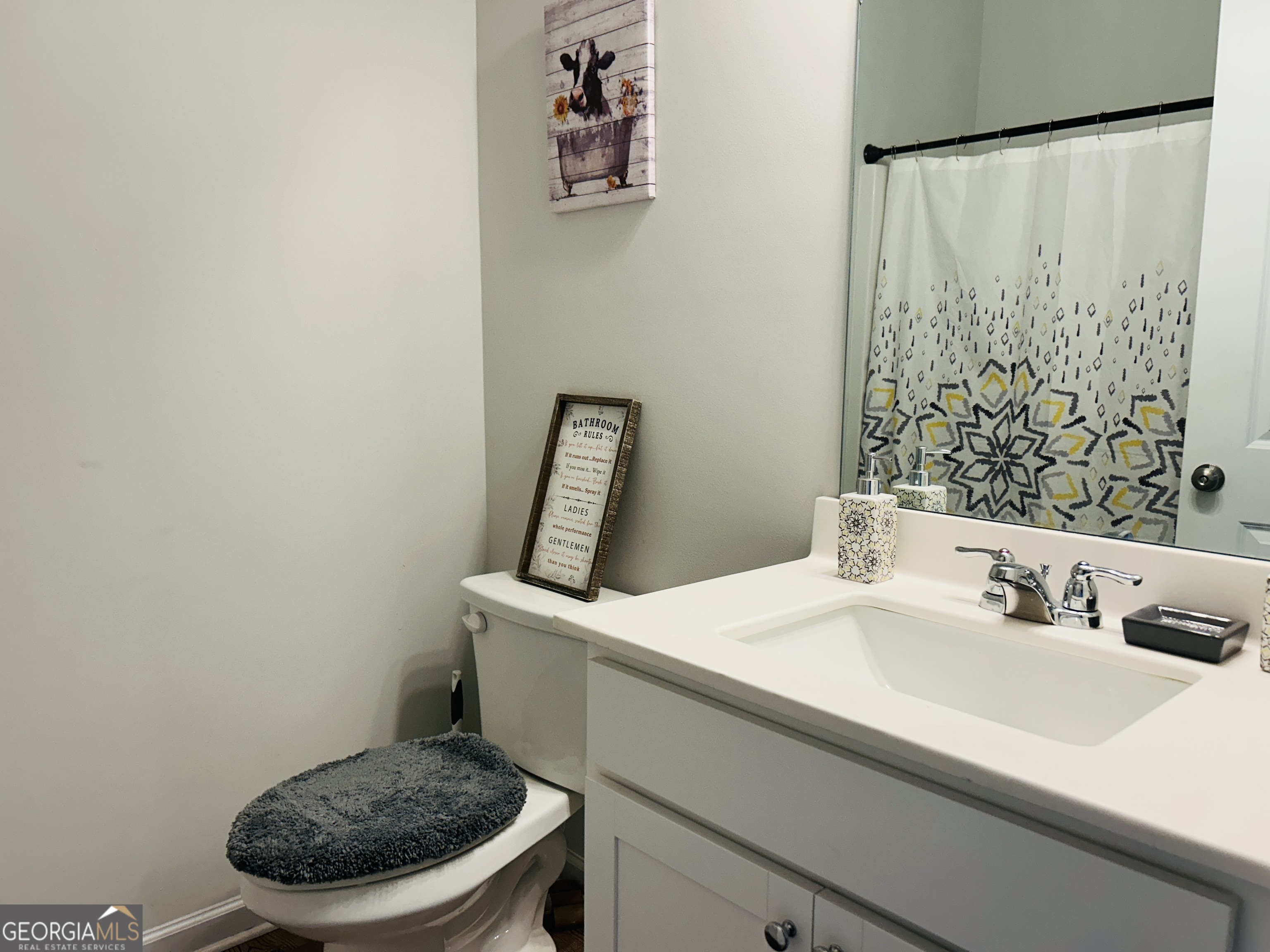 151 Sweet Briar Way Homer, GA 30547 - Photo 27 of 32 a bathroom with a sink and a mirror