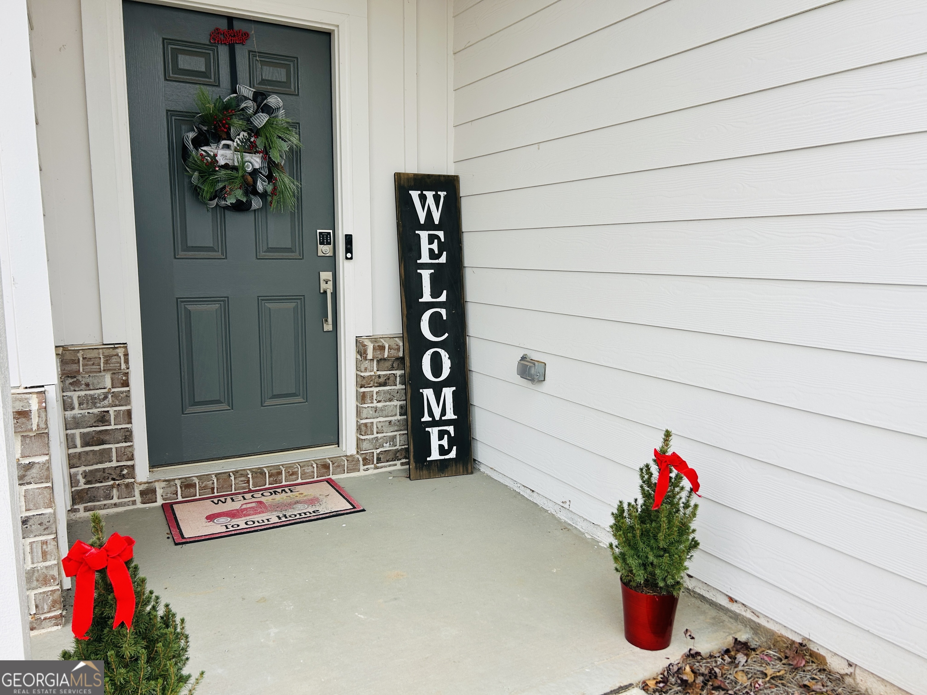 151 Sweet Briar Way Homer, GA 30547 - Photo 5 of 32 a view of a potted plant sitting in front of a door