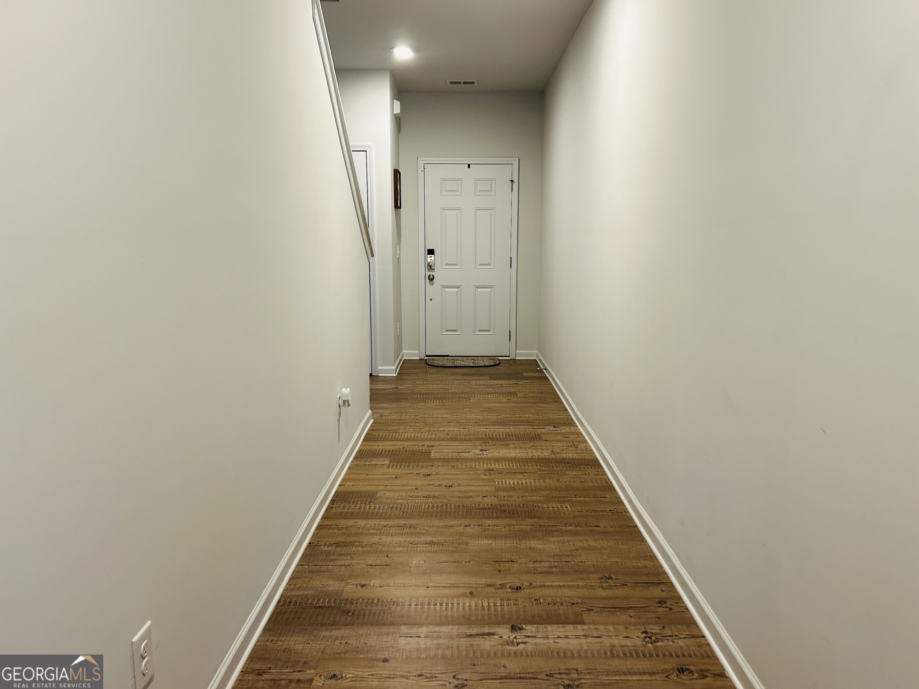 151 Sweet Briar Way Homer, GA 30547 - Photo 6 of 32 a view of a hallway with wooden floor and staircase