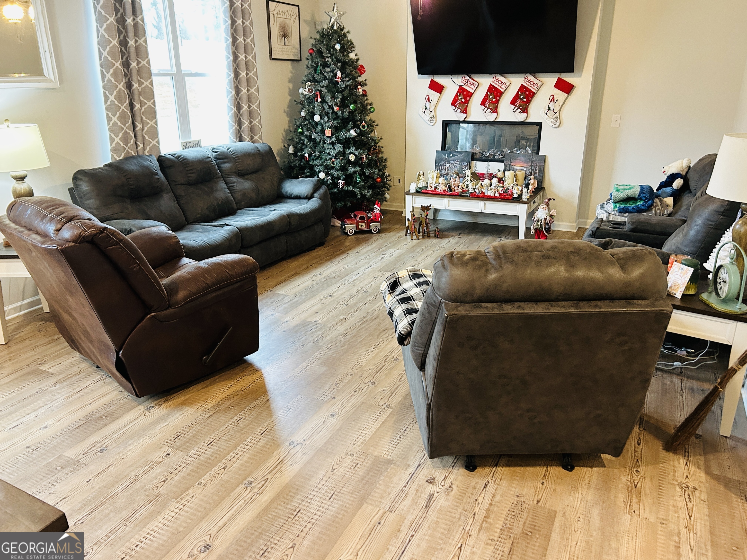 151 Sweet Briar Way Homer, GA 30547 - Photo 7 of 32 a living room with furniture and a couch