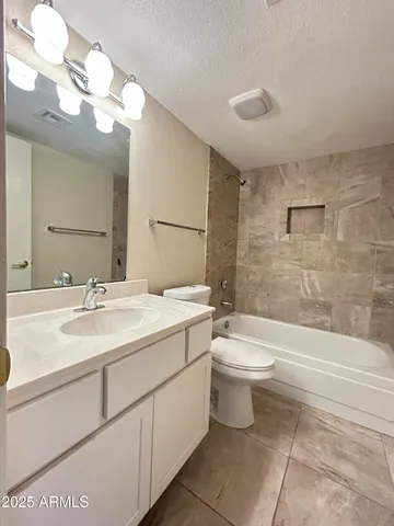 a bathroom with a toilet a sink and bathtub