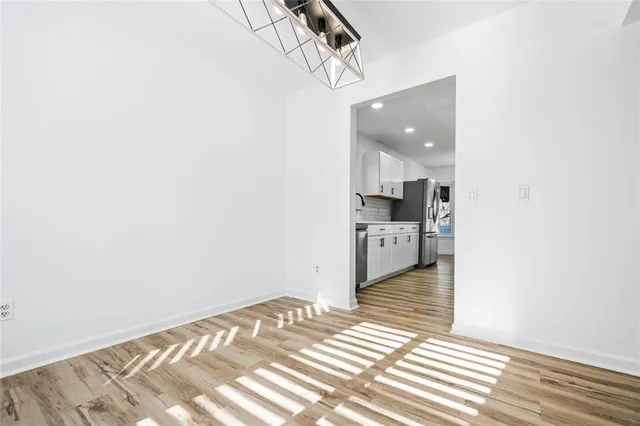 a view of a living room with a kitchen