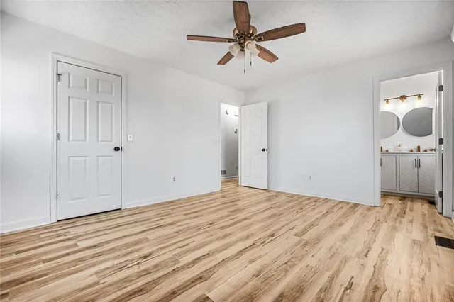 a view of a livingroom with a chandelier fan