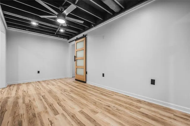 a view of room with wooden floor