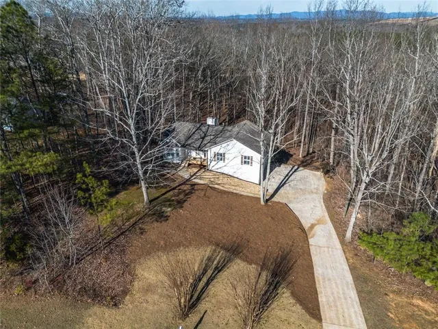 a view of a yard with trees