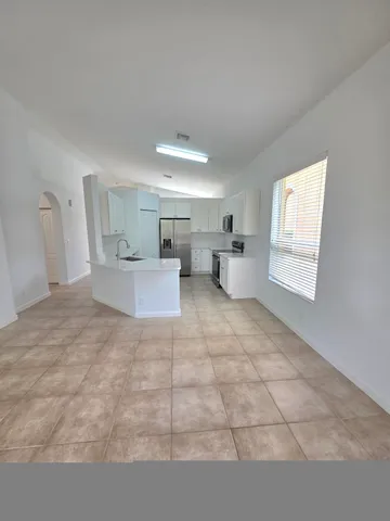 a bathroom with a sink a toilet a mirror and vanity