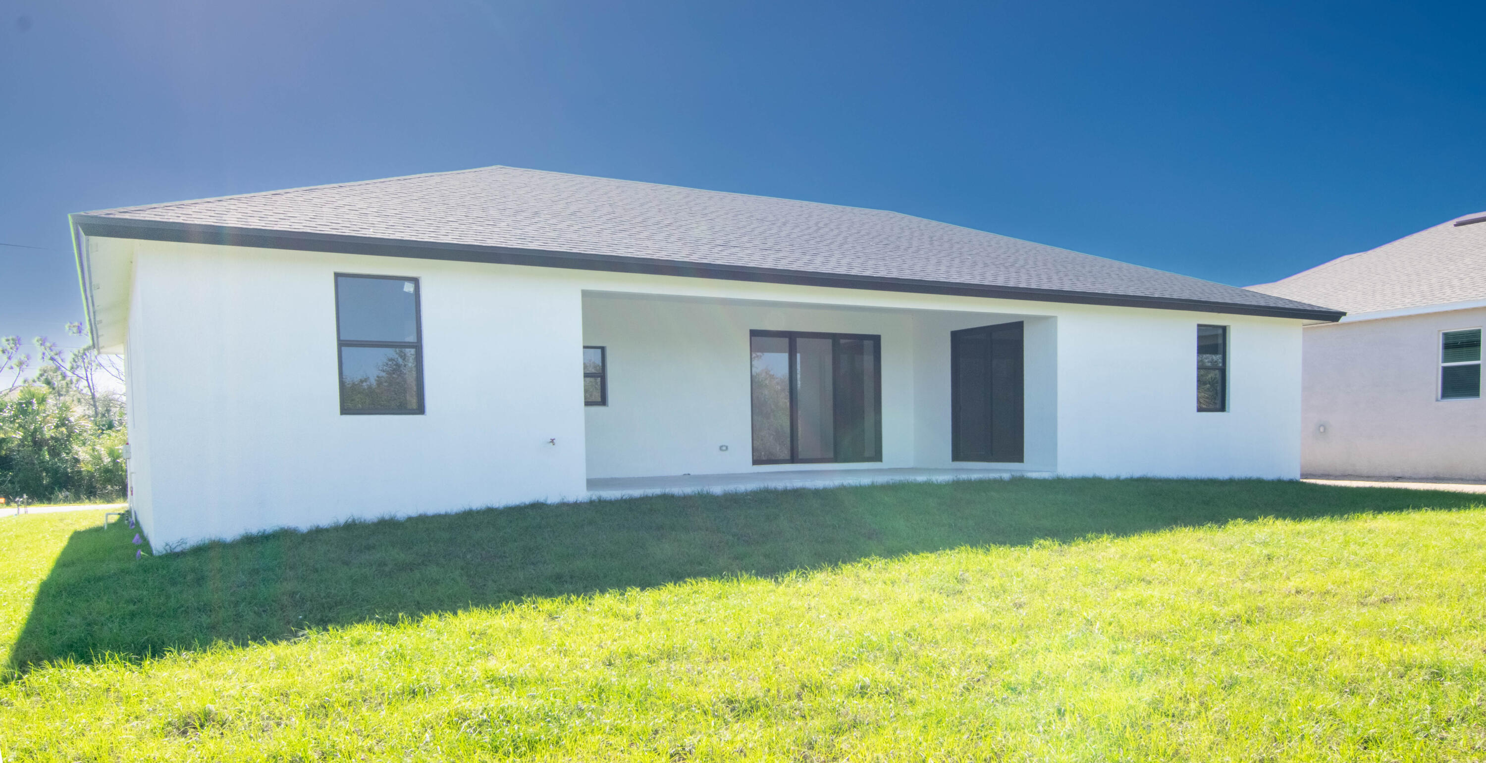 8126 Thruso Road Port Charlotte, FL 33981 - Photo 27 of 32 Back View- Backyard patio