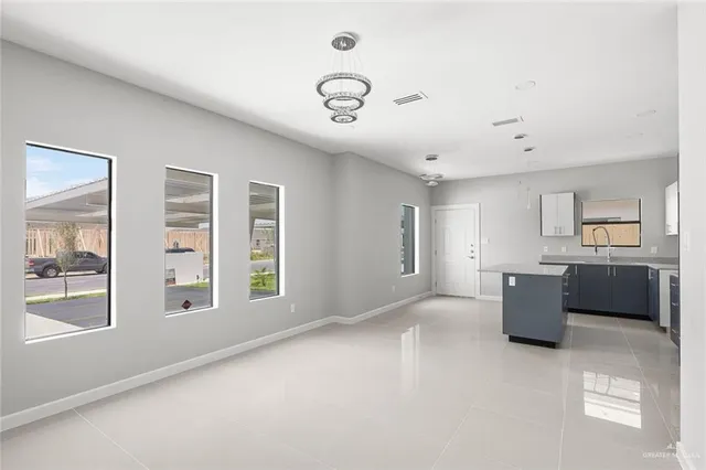 a living room with furniture and windows