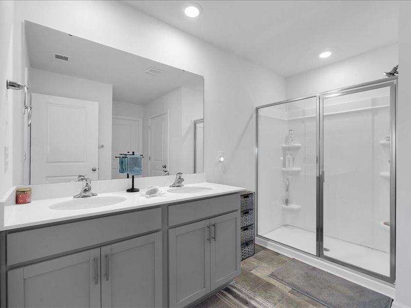 525 Ashwood Way Easley, SC 29640 - Photo 18 of 36 This bright bathroom features a spacious vanity and a walk-in shower.