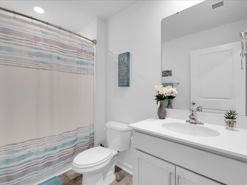 525 Ashwood Way Easley, SC 29640 - Photo 20 of 36 This clean and inviting bathroom offers a modern vanity and convenient shower area.