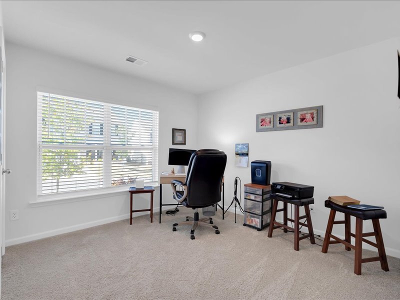 525 Ashwood Way Easley, SC 29640 - Photo 22 of 36 This versatile room offers a serene workspace with ample natural light.
