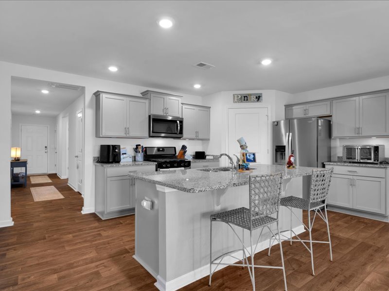525 Ashwood Way Easley, SC 29640 - Photo 6 of 36 This functional kitchen with an island is a true focal point, connecting spaces seamlessly.