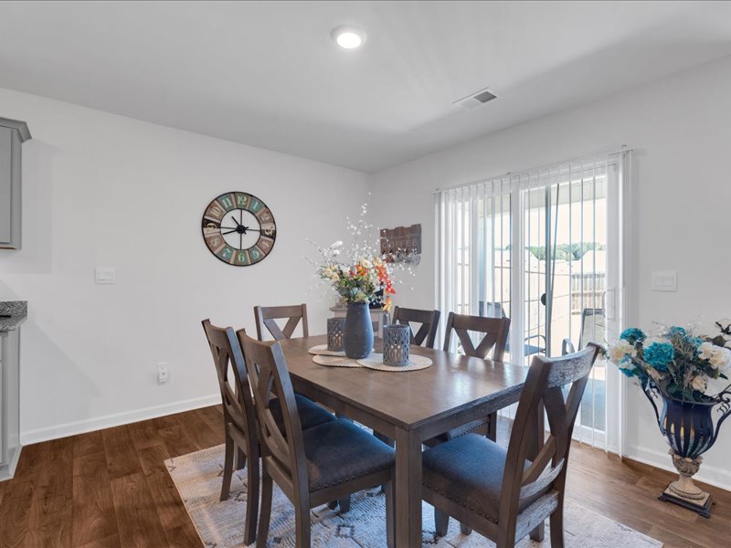 525 Ashwood Way Easley, SC 29640 - Photo 10 of 36 This inviting dining area features ample natural light and seamless outdoor access.