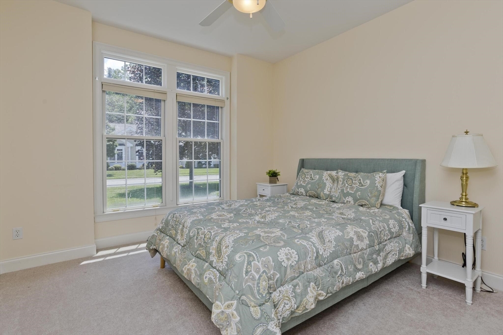 28 High Pine Circle, Unit 28 Wilbraham, MA 01095 - Photo 18 of 38 a bedroom with a bed and a window