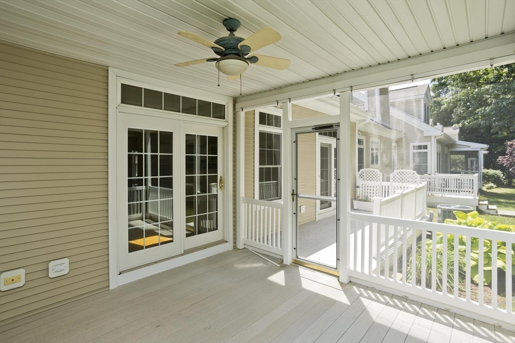 28 High Pine Circle, Unit 28 Wilbraham, MA 01095 - Photo 34 of 38 a view of a porch with a table and chairs
