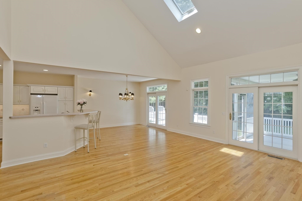 28 High Pine Circle, Unit 28 Wilbraham, MA 01095 - Photo 8 of 38 a view of an empty room with wooden floor and a window