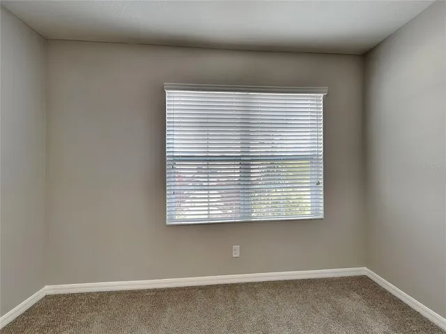 a view of a room that has a window in it