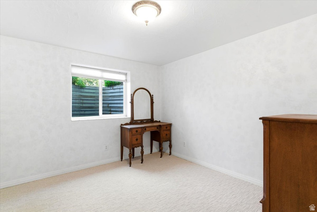 72 Canal Bank Road Garland, UT 84312 - Photo 26 of 40 Neutral tone carpeting with white baseboards throughout