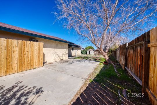 318 Reese Street Ridgecrest, CA 93555 - Photo 29 of 34 a view of a backyard with wooden fence