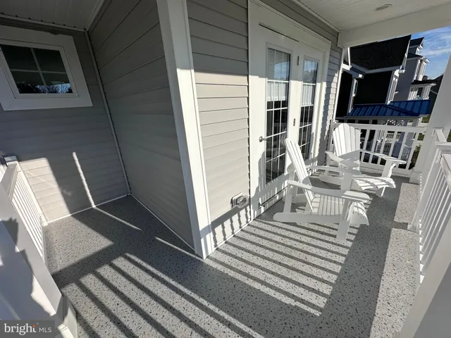 a view of balcony with furniture