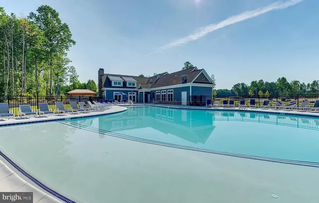 a view of a room with gym equipment and a large window