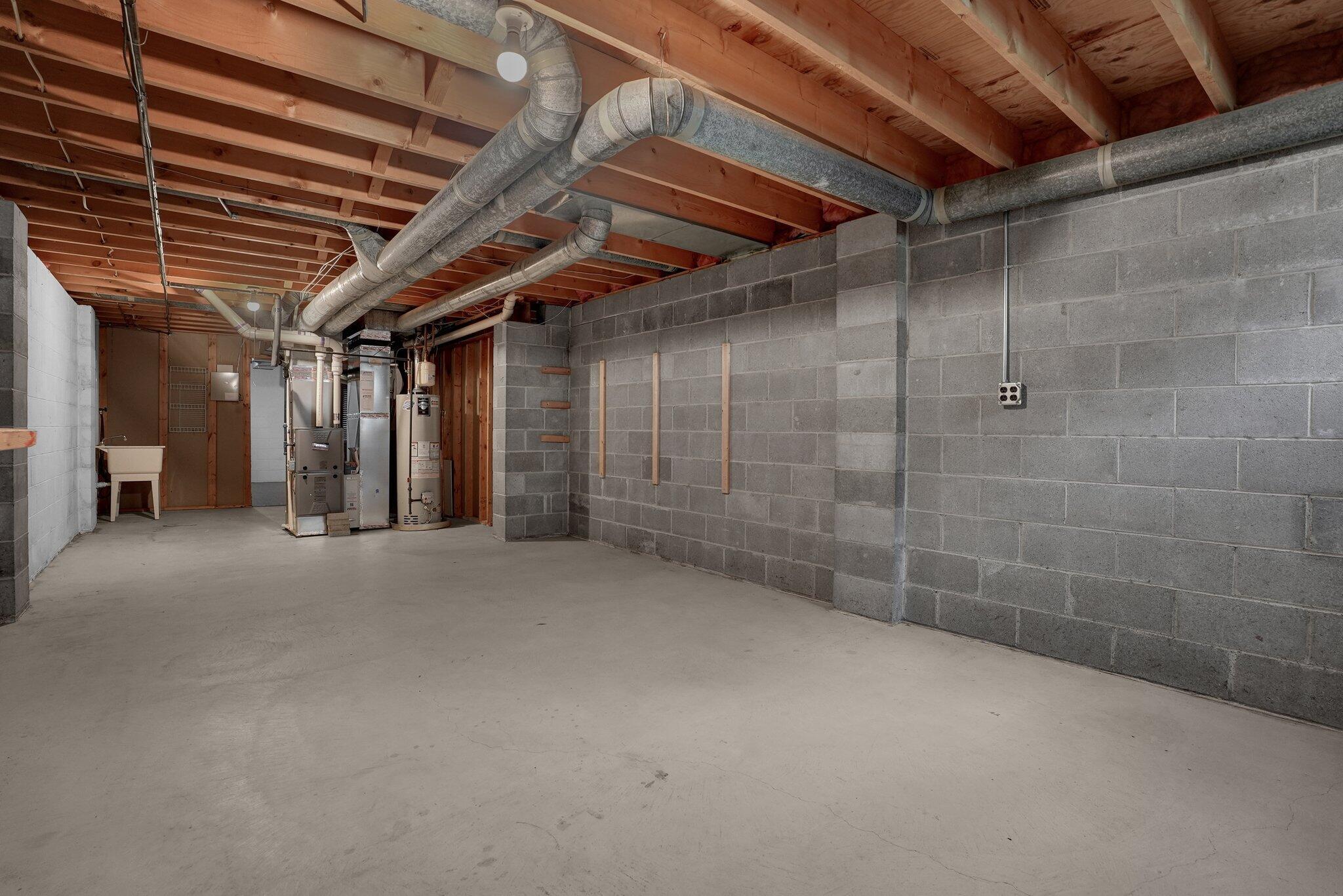 623 Rockbridge Road Westerville, OH 43081 - Photo 44 of 63 FULL partially finished basement with overhead lighting is the perfect spot for a play space, workout room, or game-day spot!