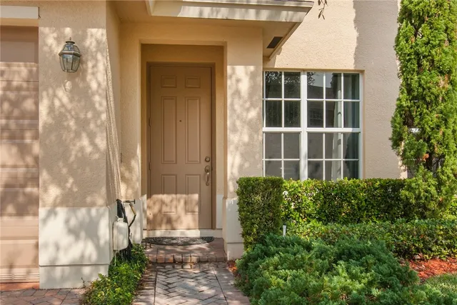 a front view of a house with a glass door