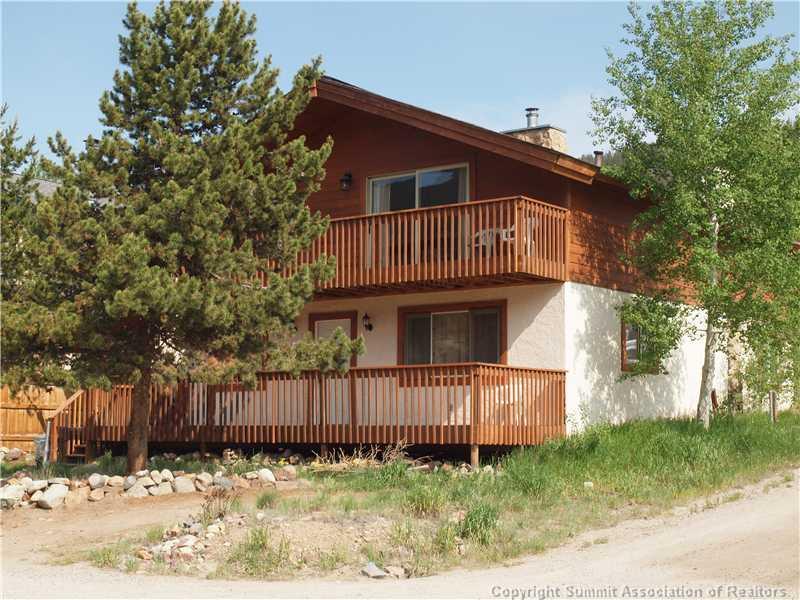17 West Hansen Road Keystone, CO 80435 - Photo 1 of 25 a view of a wooden house with a wooden fence and trees