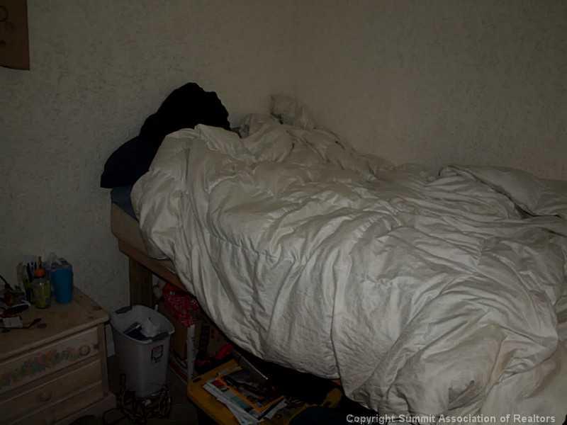 17 West Hansen Road Keystone, CO 80435 - Photo 22 of 25 a close up of a bed in a room