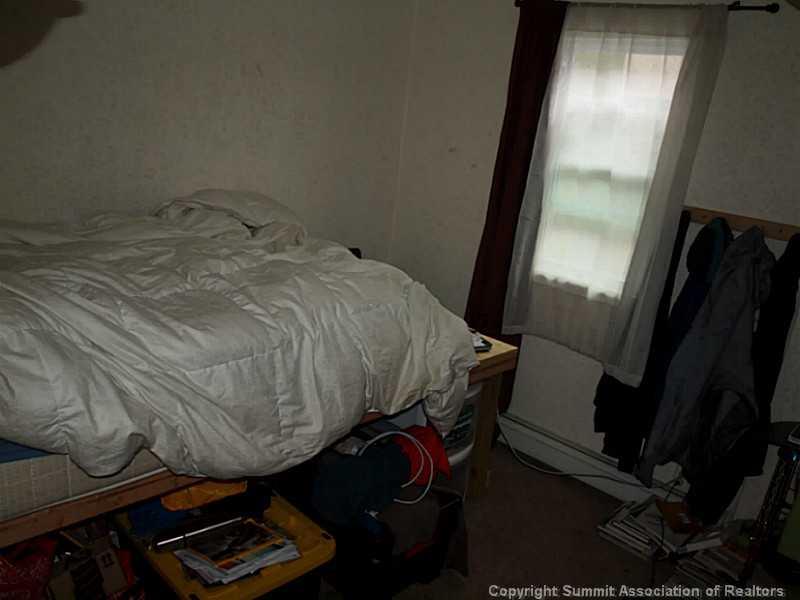 17 West Hansen Road Keystone, CO 80435 - Photo 23 of 25 a bedroom with a bed and a mirror