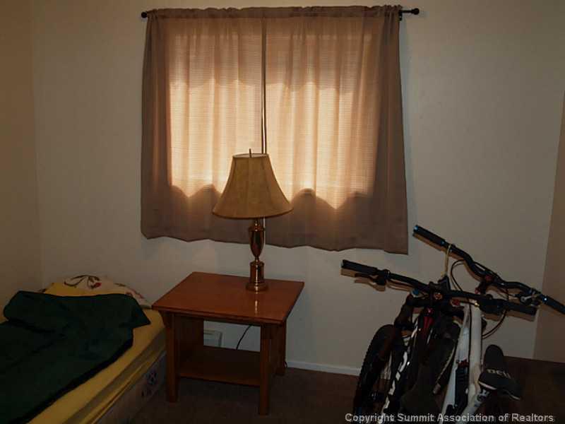 17 West Hansen Road Keystone, CO 80435 - Photo 8 of 25 a lamp on a desk next to a window