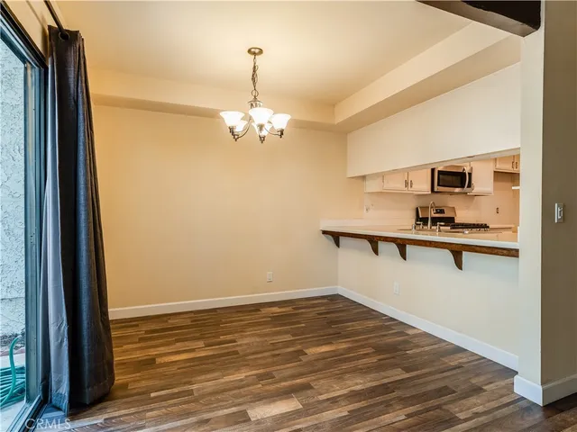 a view of a kitchen from the hallway