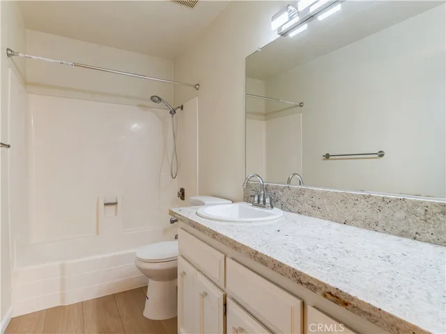 a backyard of a house with outdoor seating