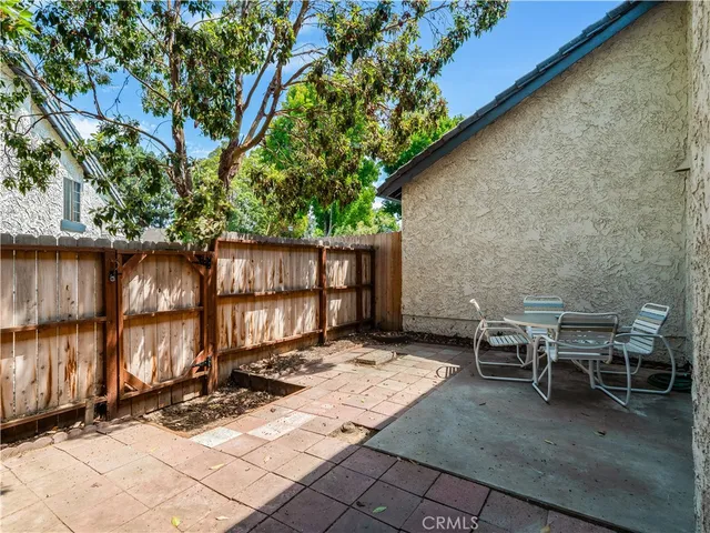 a view of a bench in wooden floor