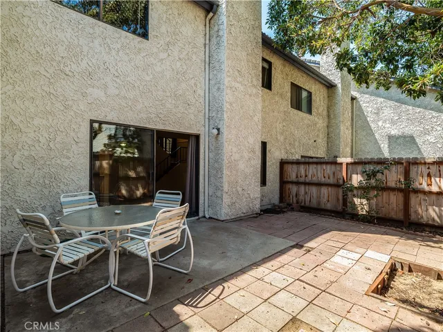a view of a park with large trees