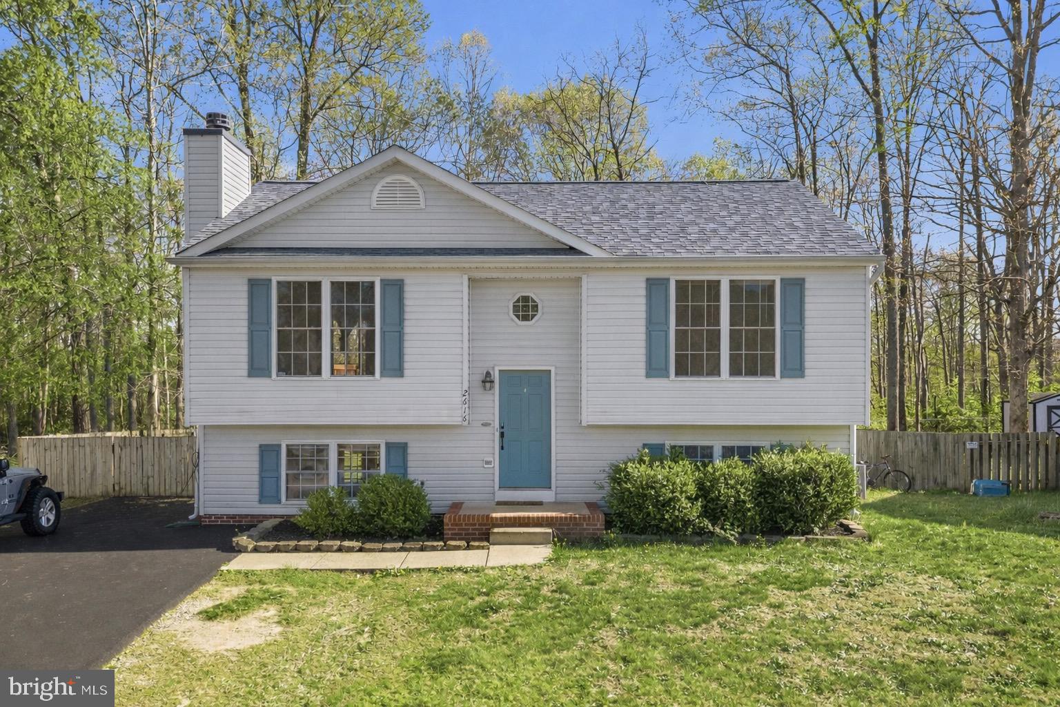 2616 Ruffin Drive Fredericksburg, VA 22408 - Photo 1 of 36 a front view of a house with a yard